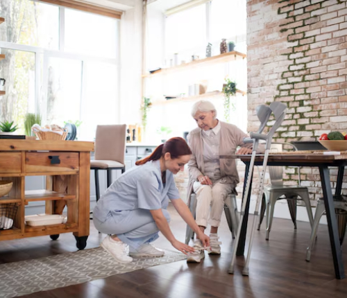 NDIS Assistance with Household Tasks caregiver helping senior with daily activities.
